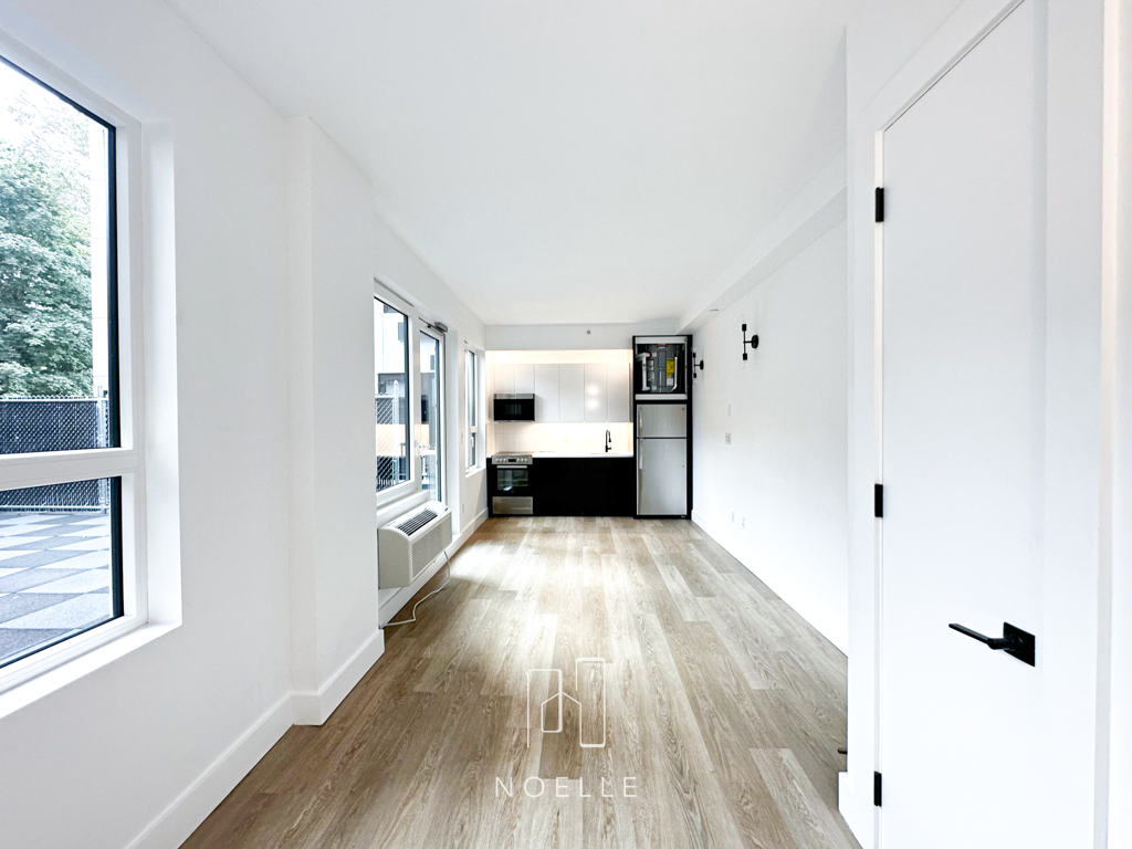 apartment for rent in crown heights, brooklyn. photo shows kitchen and living space.